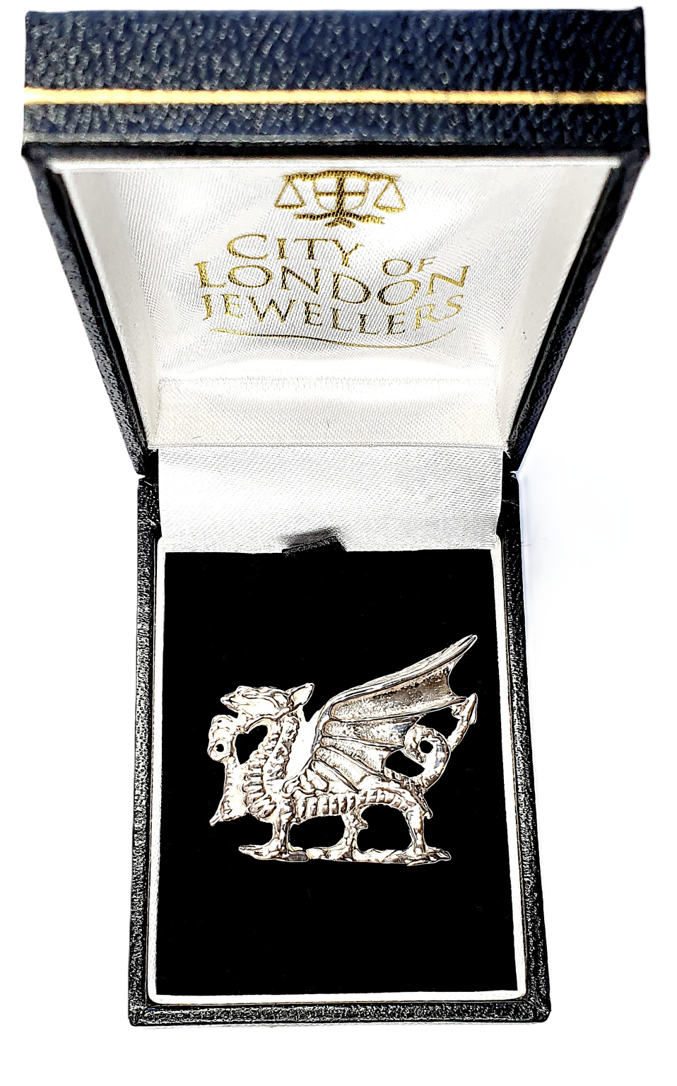 Crafted from premium silver, this exquisite dragon brooch symbolizes strength and pride, making it an elegant gift. Pictured in a black velvet box.