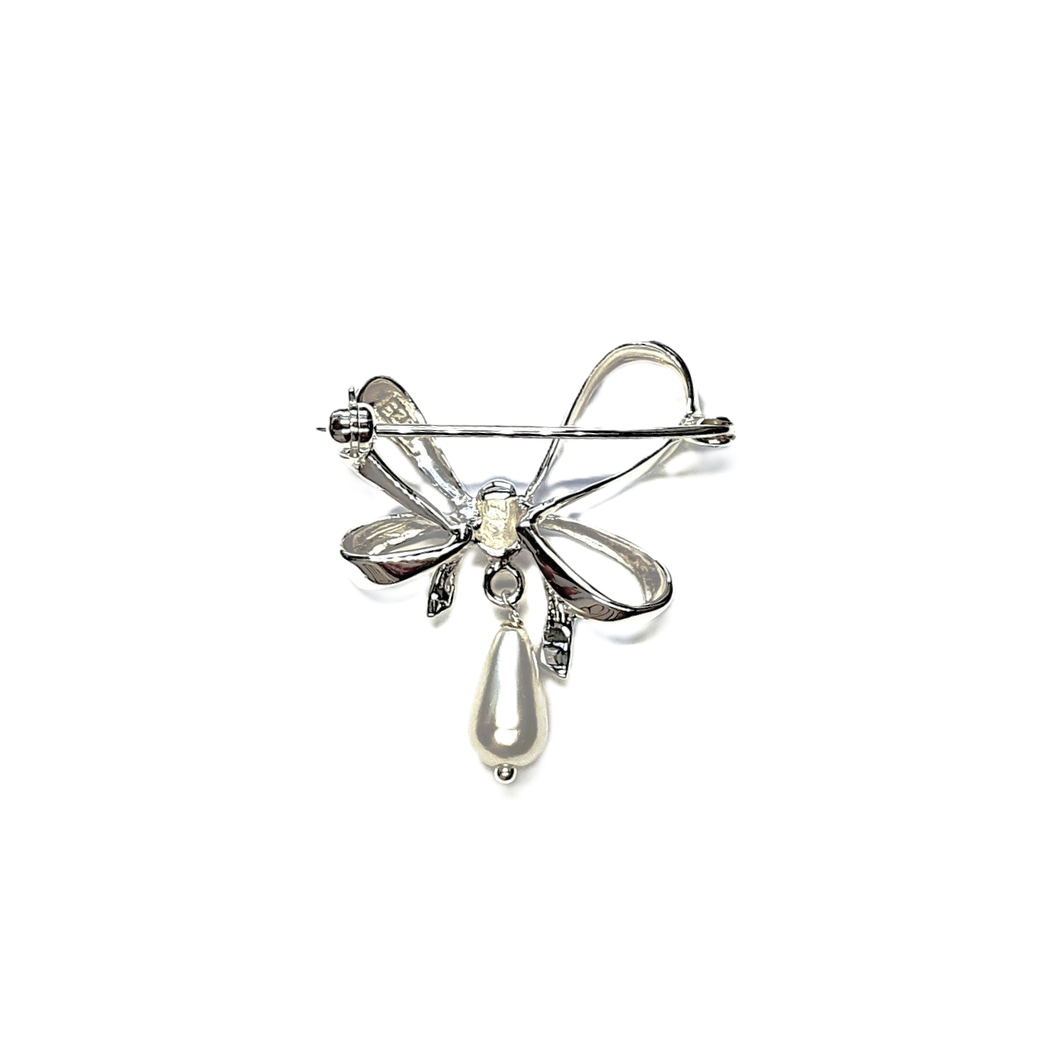 The back view of a bow-shaped brooch highlighting the secure pin and catch mechanism.