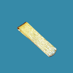 Tree-barked patterned money clip in 9ct gold pictured on a blue back ground.