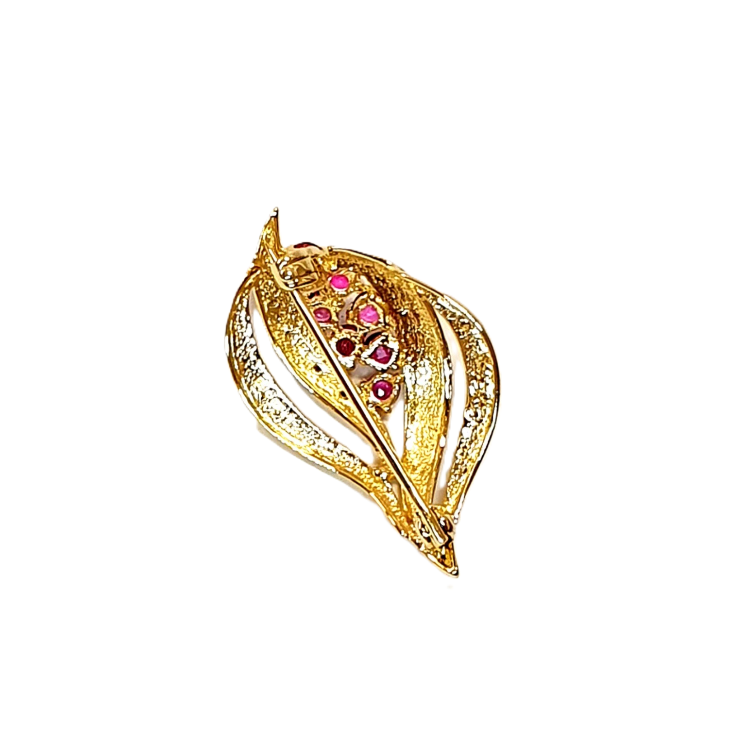 View of the back of rubie and diamond brooch.