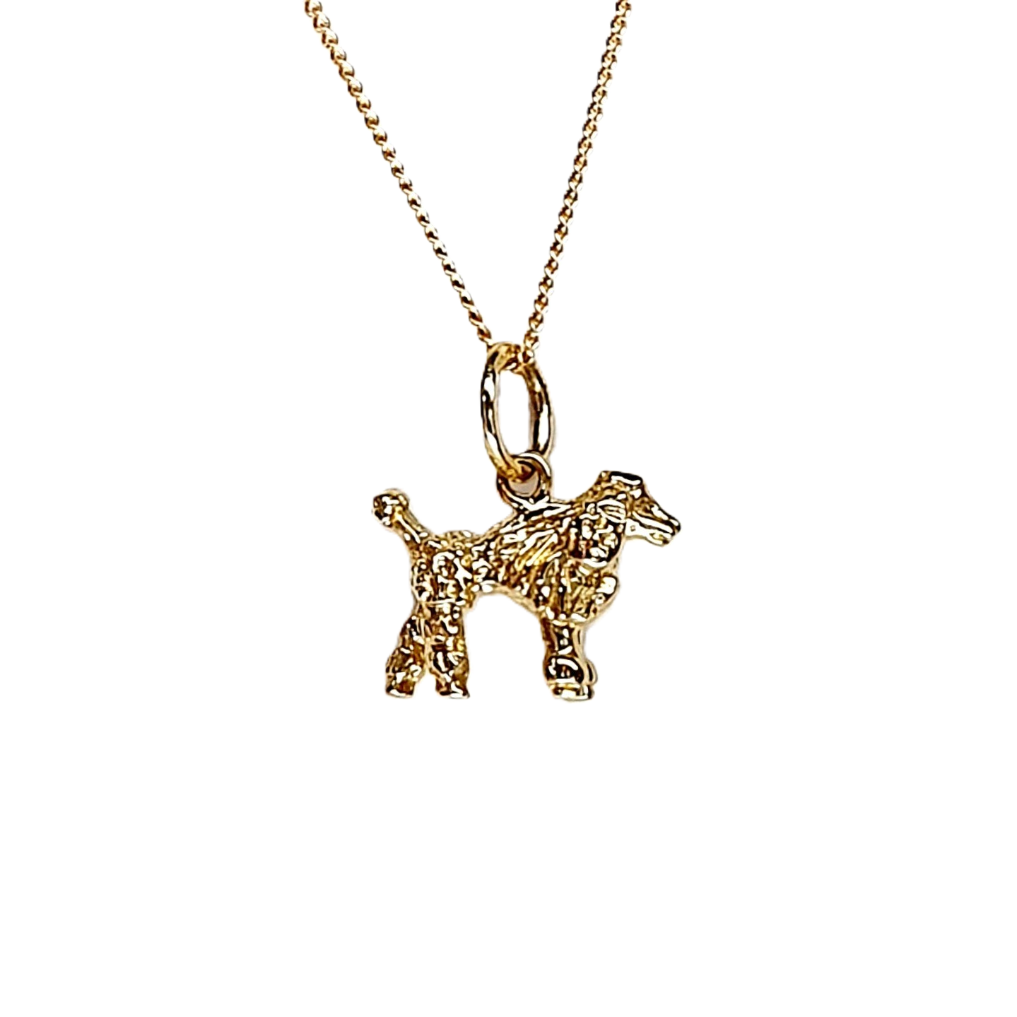 A solid 3D 9ct gold Poodle pendant necklace CMP00299.Pictured close up facing to the right, hanging on a chain.