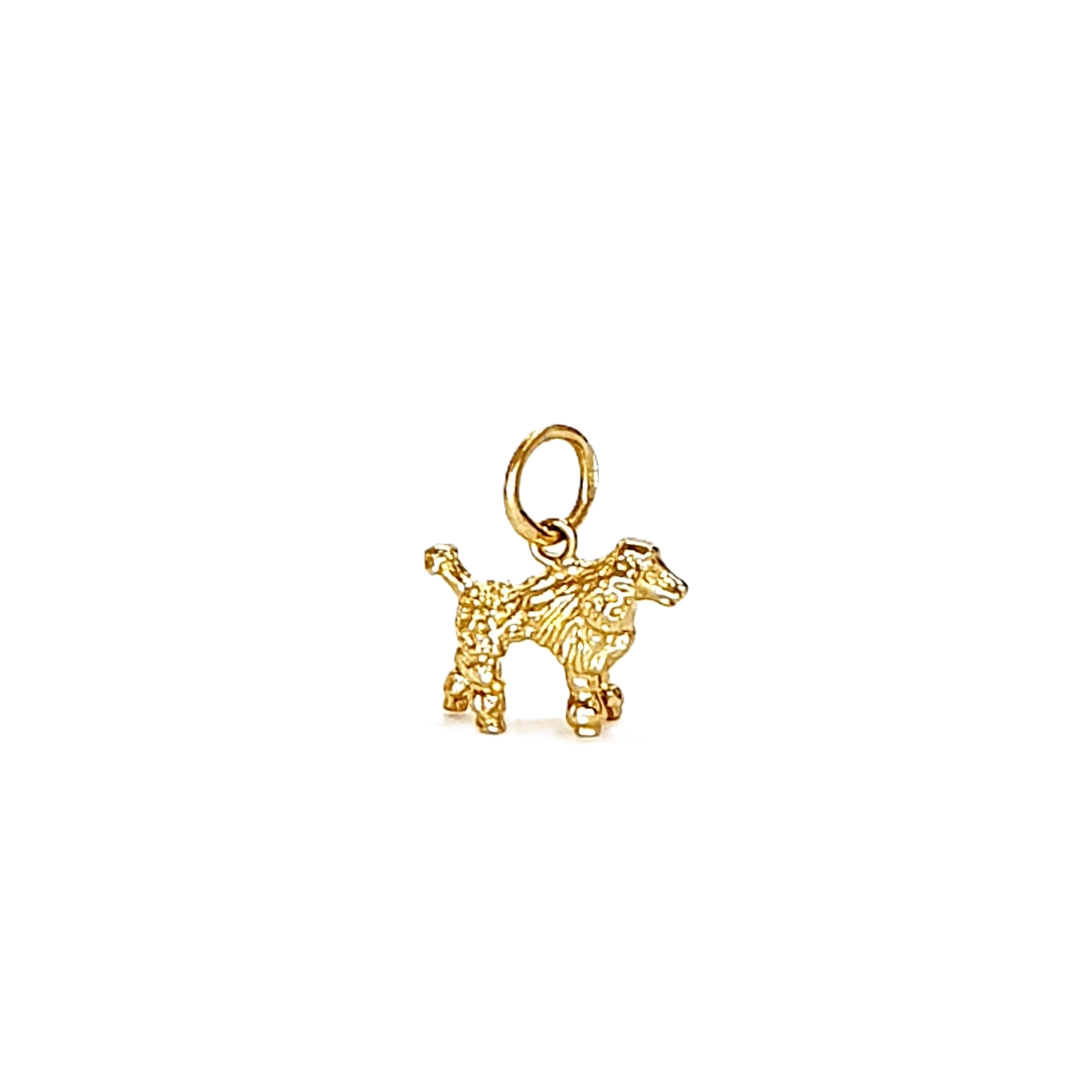 A solid 3D 9ct gold Poodle charm for a bracelet or necklace CM00299.Pictured facing to the right.