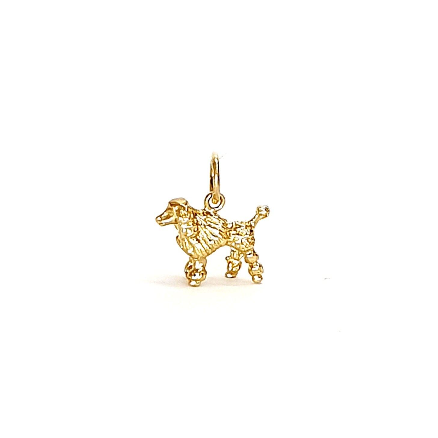 A solid 9ct gold Poodle charm for a bracelet or necklace CM00299.Pictured facing the left.