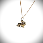 Close-up picture of a 3D lion necklace facing right, at a slight angle.