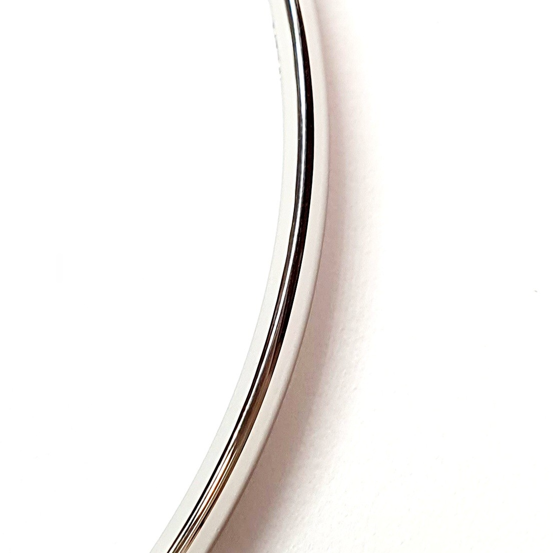 Closer up of a section of the white gold court shape bangle.