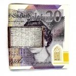 9-carat gold money clip with a barked pattern pictured with a £20.00 note.