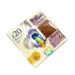 Picture of the polished back of a 9ct gold money clip with a twenty pound note.