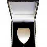 A solid gold money clip is pictured in the gift box.