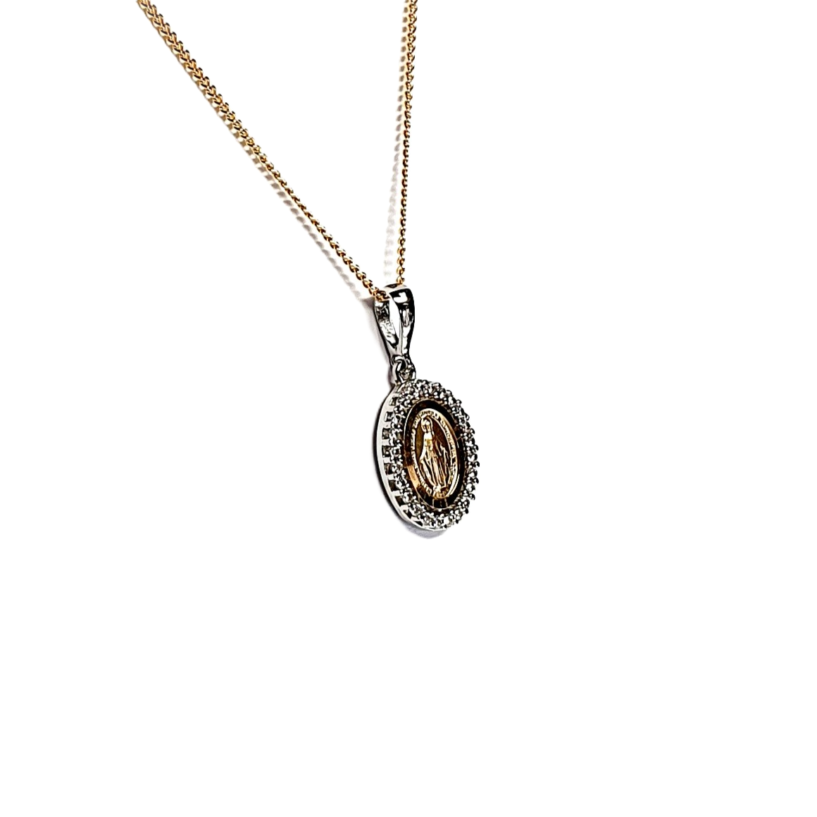 Two-tone 9-carat gold Madonna pendant and chain surrounded with cubic zirconia. The front view leans left to show at an angle.
