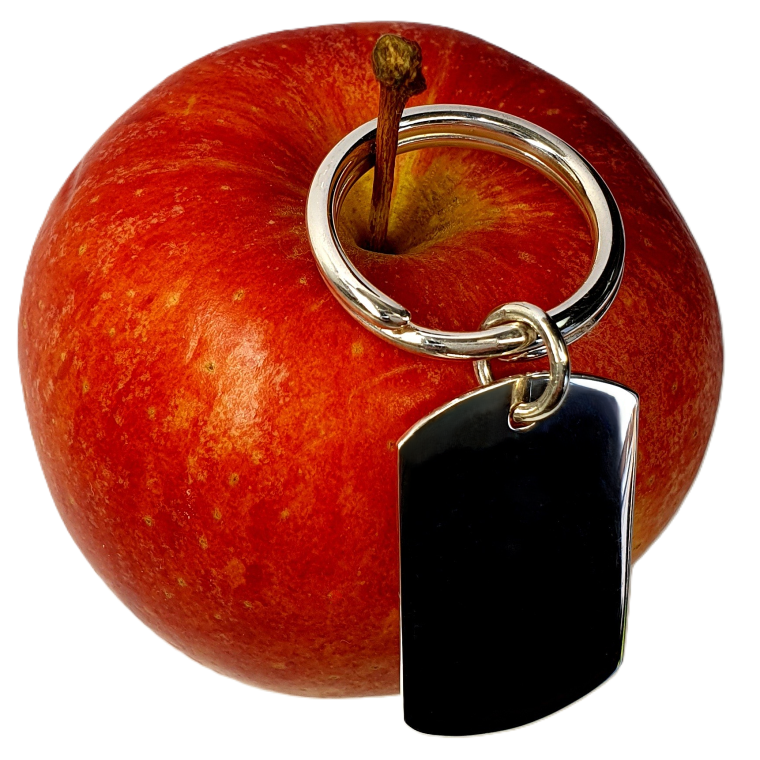 A rectangular sterling silver keyring fob with a prominent hallmark on one side, a picture of the plain polished back hanging from an apple.