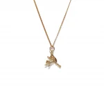 9ct yellow gold witch on her broomstick necklace with a close link curb chain.