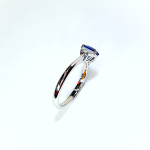 White gold, blue sapphire and diamond engagement ring