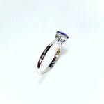 White gold, blue sapphire and diamond engagement ring