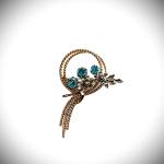 Blue stone brooch pin.