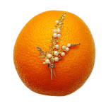 Yellow gold three sprig brooch pin with fourteen pearls pictured on an orange.