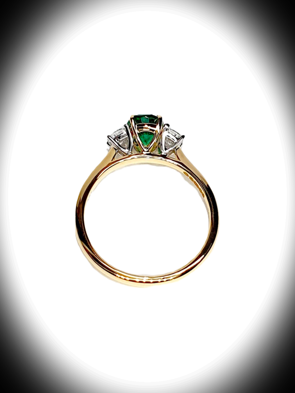 Close-up of the detailed view of the side of the ring, highlighting the intricate design and craftsmanship supporting the gemstone settings. Only the diamonds are set in white gold, and every other part is in yellow gold RA00700.