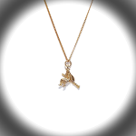 The golden witch is flying past the moon on her broomstick.