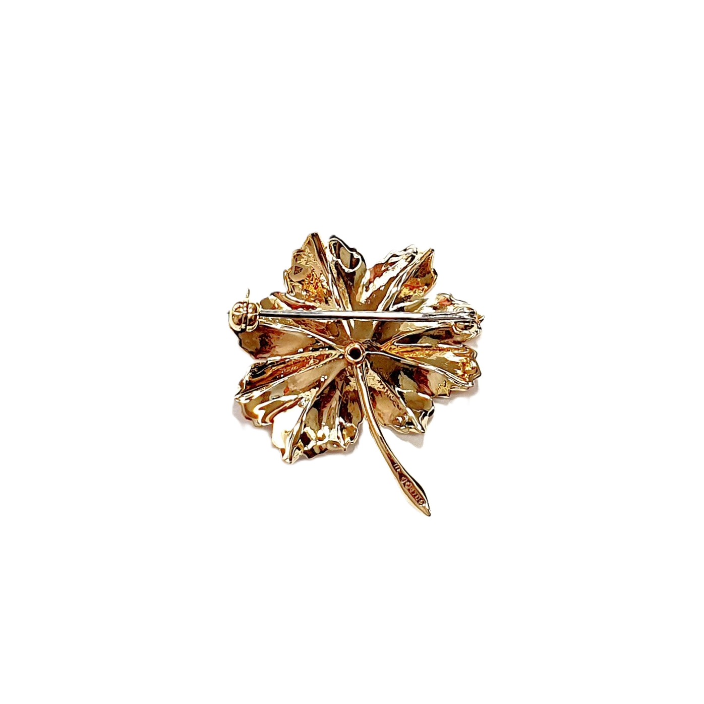 This is a picture of the back of the leaf brooch, showing the polished finish, the pin, and the swivel safety catch.