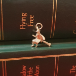 9ct yellow gold witch on her broomstick charm CM00301.