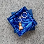 Genuine hallmarked silver ginger cat keyring fob or handbag charm with a ginger and white life-like enamelled finish KF00049.Pictured in the gift box.