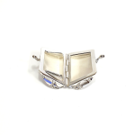 Sterling silver pill box opened wide, displaying full interior and lid curvature against neutral backdrop.