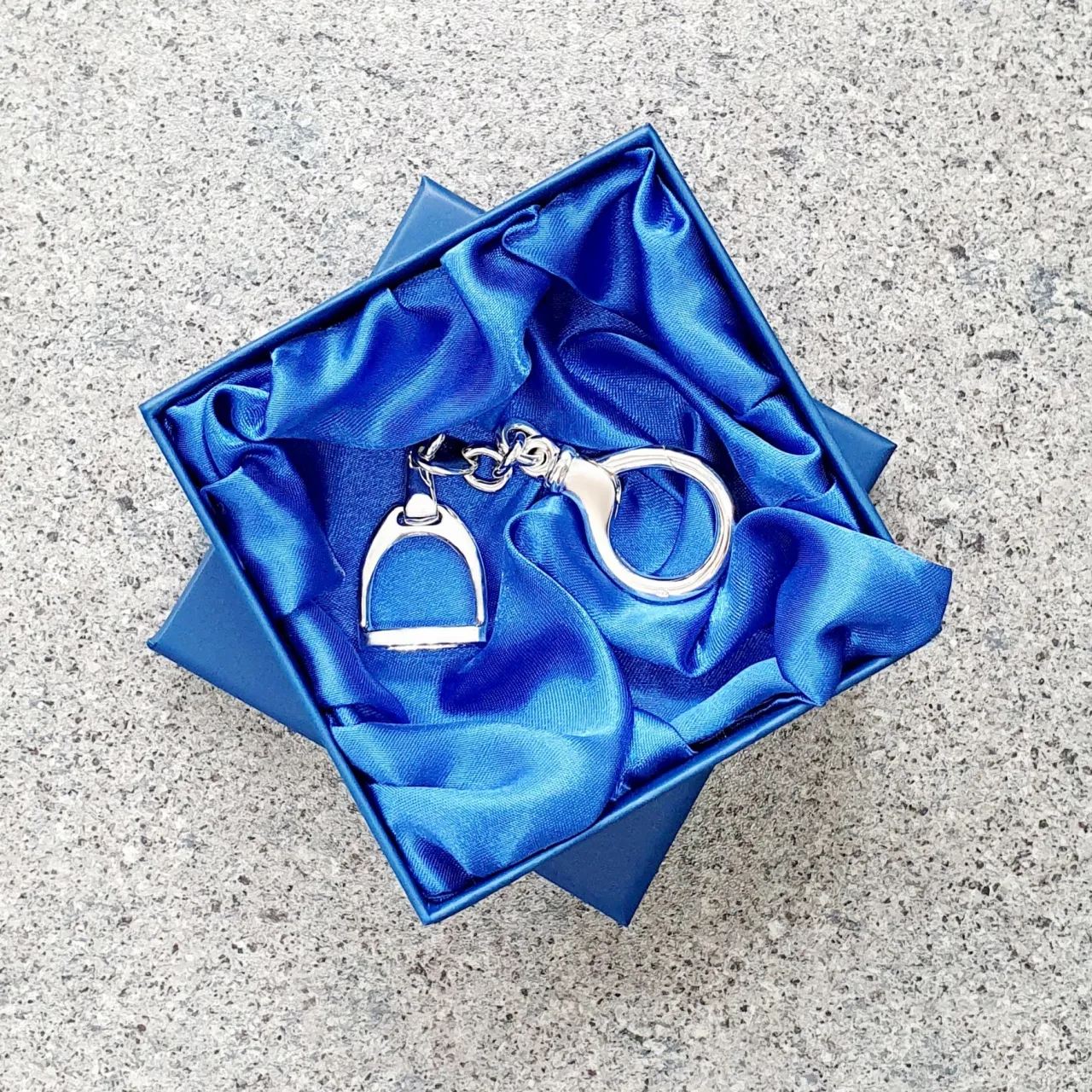 Hallmarked stirrup key fob with a highly polished finish. Pictured in the gift box.
