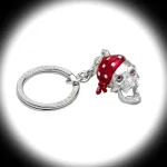 Edgy & Gothic: This jaw-dropping sterling silver skull keyring, made in the UK, boasts a vibrant red bandana, eerie red popping eyes, and a rebellious aesthetic.