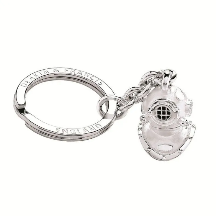 Nautical: "A refined diver’s helmet keyring in sterling silver detailing, inspired by deep-sea exploration."