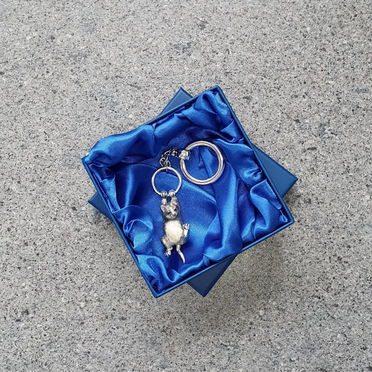 Genuine hallmarked silver tabby cat keyring fob or handbag charm with a grey brown life-like enamelled finish KF00048.Pictured in the gift box.