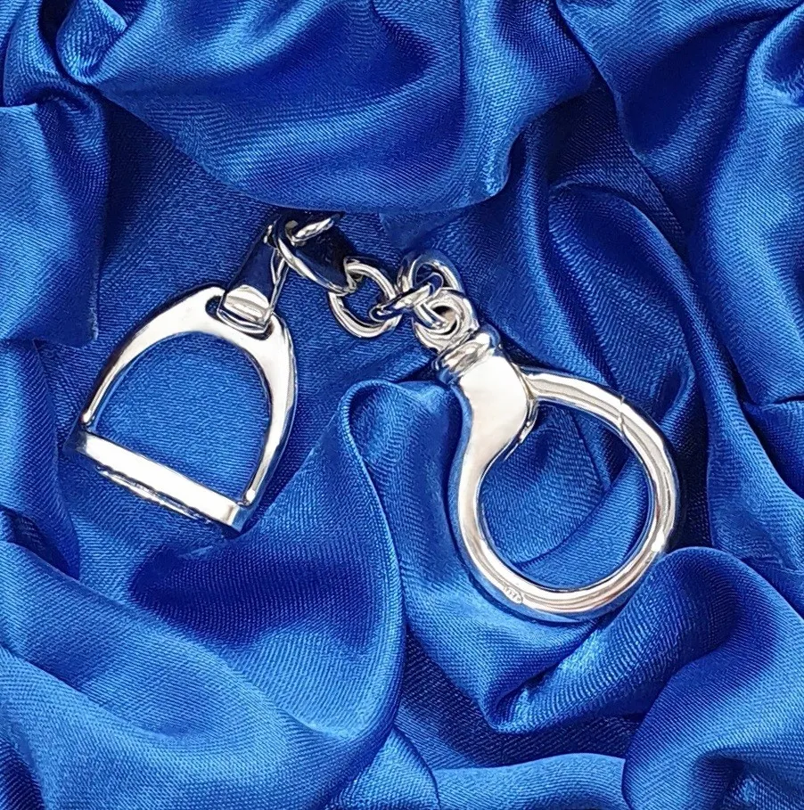 Hallmarked stirrup key fob with a highly polished finish. Pictured in the gift box.