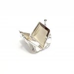 Sterling silver pill box opened, showing interior craftsmanship and hinge detail