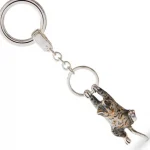 Hallmarked 925 silver cat keyfob or handbag charm with grey and brown enamel swinging from a ring.
