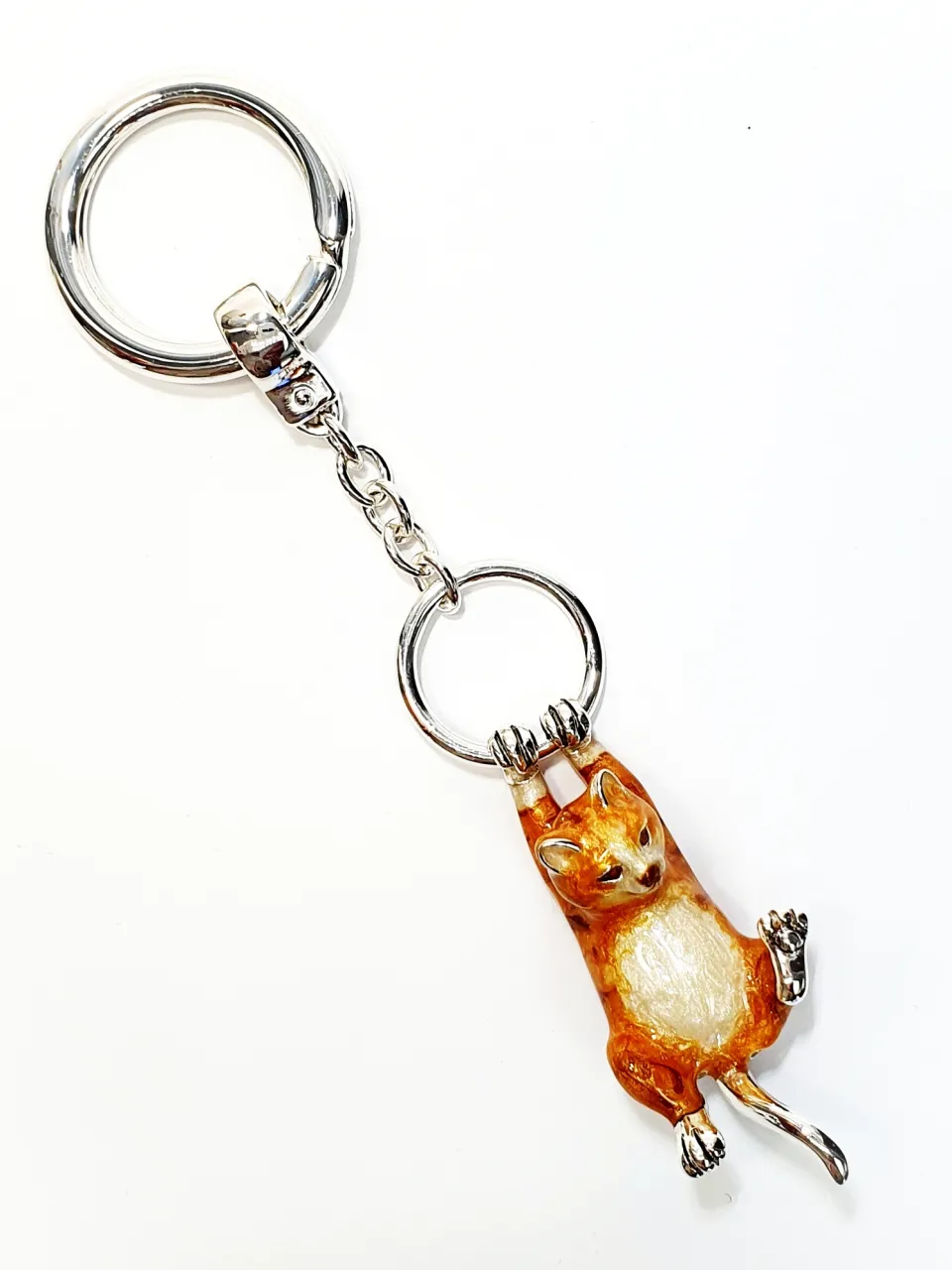 Hallmarked 925 silver ginger cat key fob or handbag charm with ginger and white enamel swinging from a ring.