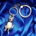 Genuine hallmarked silver tabby cat keyring fob or handbag charm with a grey brown life-like enamelled finish KF00048.Pictured in the gift box.