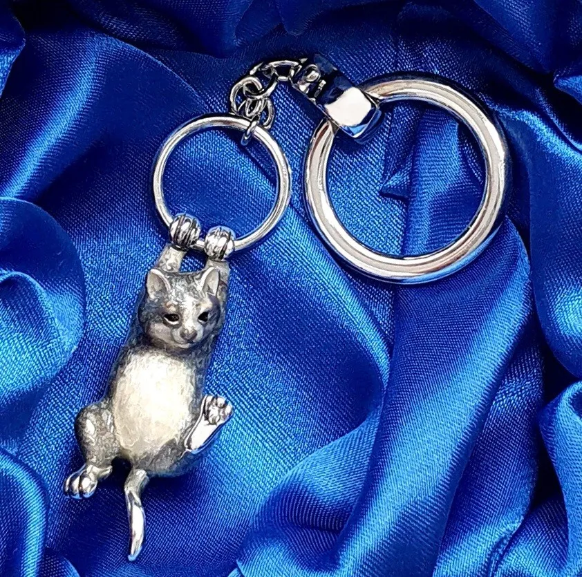 Genuine hallmarked silver tabby cat keyring fob or handbag charm with a grey brown life-like enamelled finish KF00048.Pictured in the gift box.