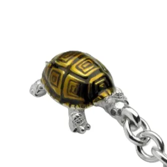Close-up picture of Hallmarked sterling silver tortoise keyring fob with brown enamel and real blue sapphire eyes KF00060.