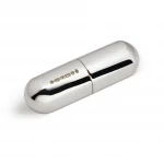 A compact silver pill box in capsule form was photographed against a soft white background, showing the hallmark.