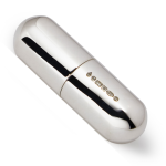 A compact silver pill box in capsule form was photographed against a soft white background, showing the hallmark.
