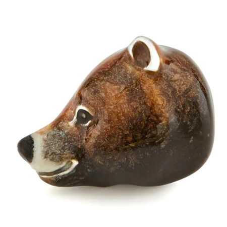 Close-up of Saturno sterling silver bear cufflinks with brown enamel detailing.