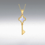 A softly lit gradient background brings out the subtle texture and multicoloured glow of the mother of pearl inside the golden key pendant.