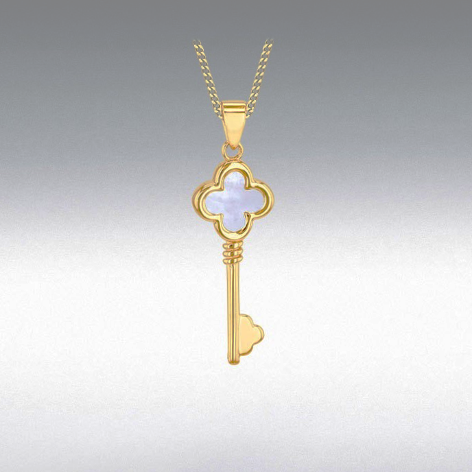 A softly lit gradient background brings out the subtle texture and multicoloured glow of the mother of pearl inside the golden key pendant.