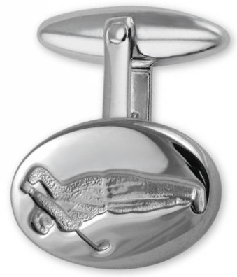 Detailed close-up of golfer engraving on sterling silver cufflink, showcasing fine texture, artisanal finish, and subtle shine.