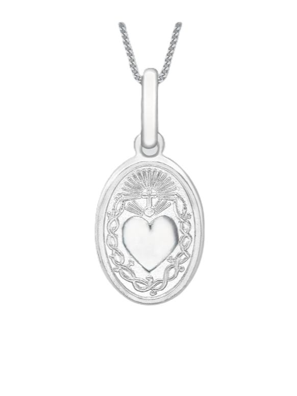 Detailed close-up of Sacred Heart pendant revealing satin-polished surface, delicate edges, and bail attachment in 9ct white gold.