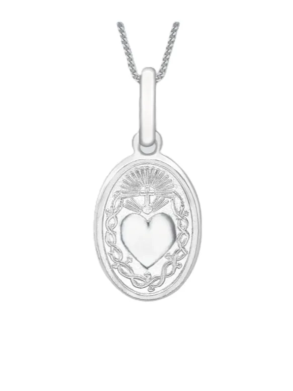 Detailed close-up of Sacred Heart pendant revealing satin-polished surface, delicate edges, and bail attachment in 9ct white gold.