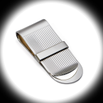 "Dramatic spotlight on the Stripe Money Clip with polished band across stripes, highlighting its engraving-ready surface and silver craftsmanship."