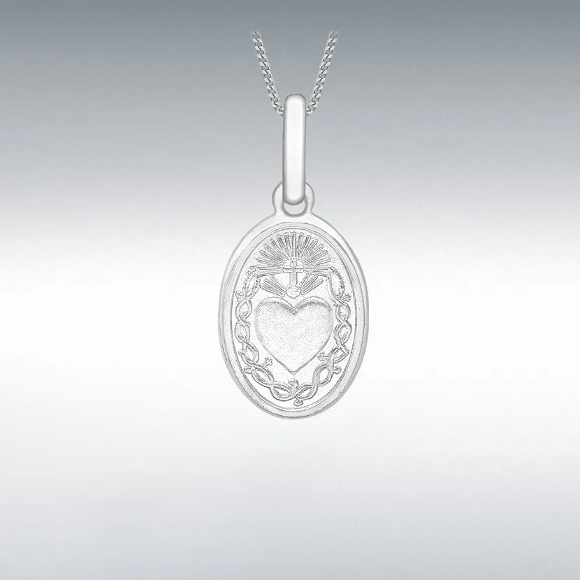 Stylishly presented Sacred Heart Necklace placed on grey background, contrasting tone accentuates the gold’s subtle brilliance.