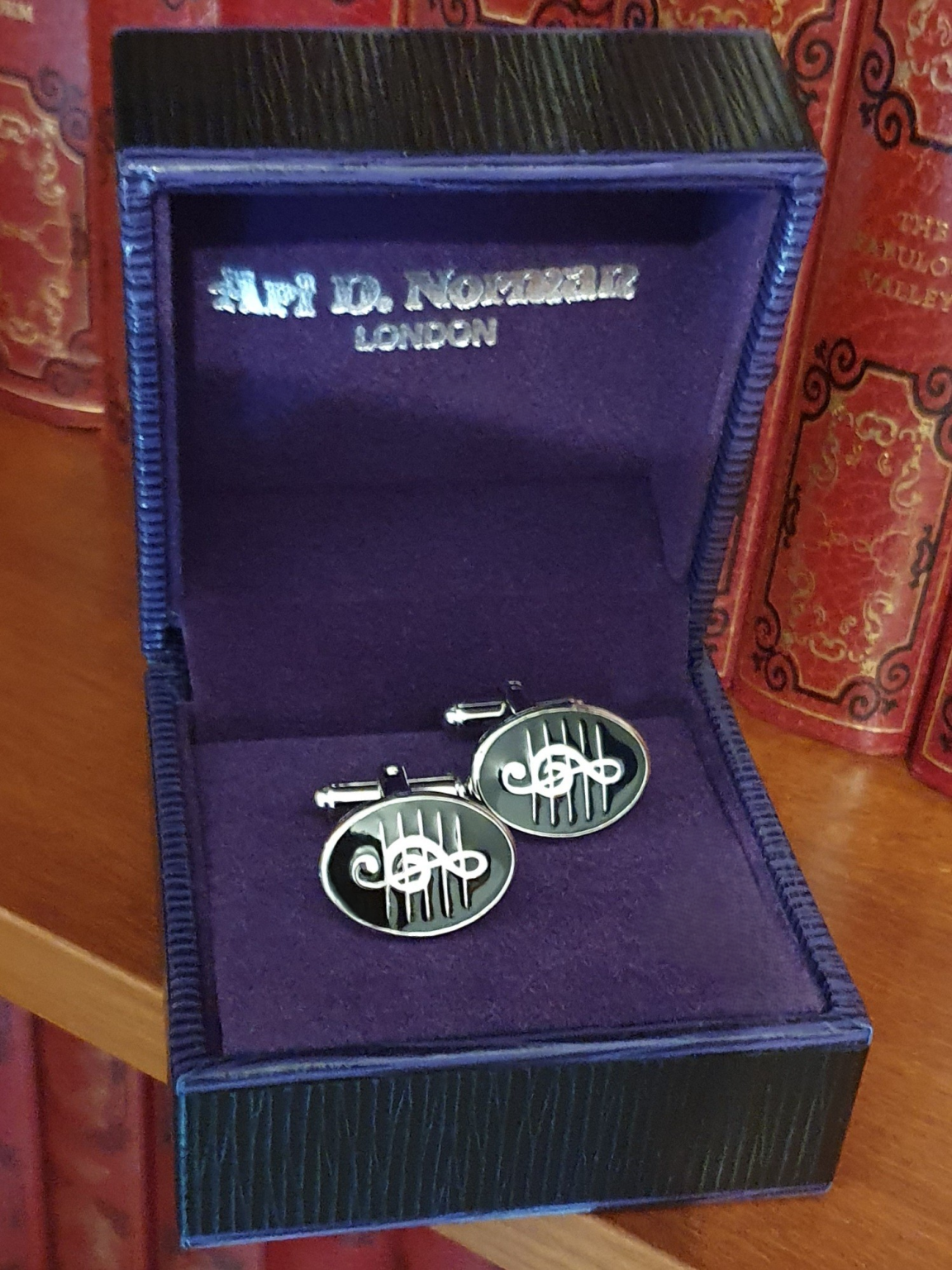 Treble Clef cufflinks presented in Ari D Norman purple gift box, ideal for gifting and presentation