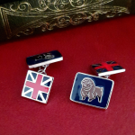 Sterling silver cufflink shown from a front angle, highlighting enamel detail and polished finish.