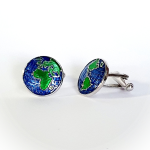 World map cufflinks shown with one facing front and one angled to the left, revealing enamel detail