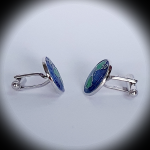 Spotlight effect on world map cufflinks, highlighting edge detailing and globe motif